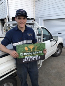 Meet Levi - holding his new business sign in front of his ute.