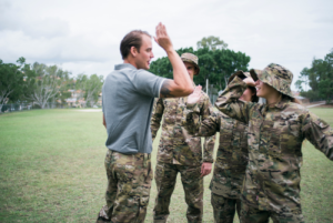 Veteran Mentors role model high-fives participants